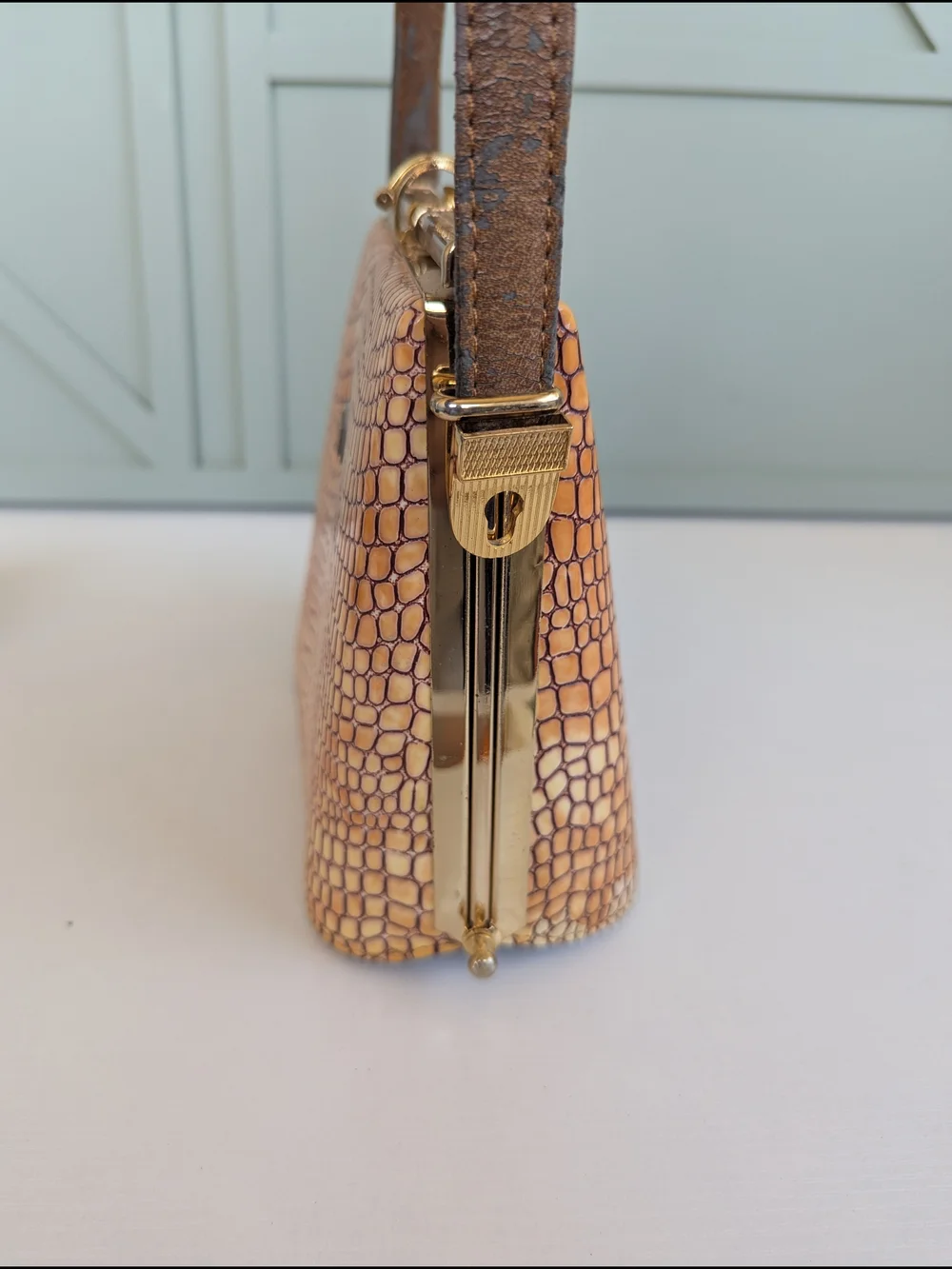 vintage 1950s-1960s frame handbag, featuring an embossed crocodile pattern